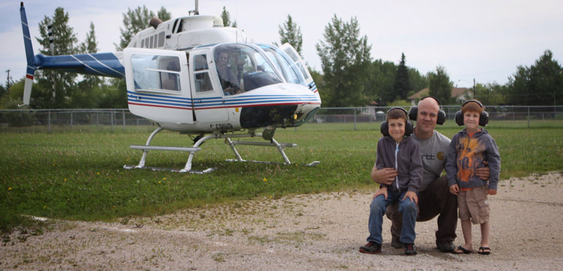 Boys getting a helicopter ride